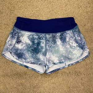 Ivivva by Lululemon Speed running shorts in a blue, white, and black
